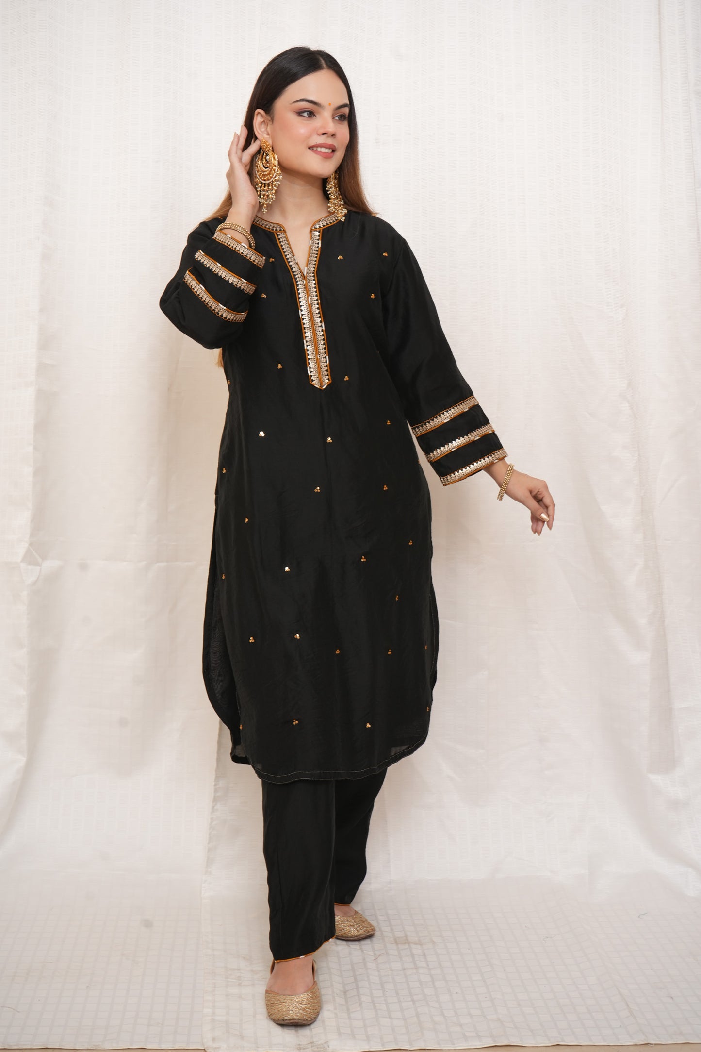 Black sequence embellished Chanderi suitset with yellow dupatta