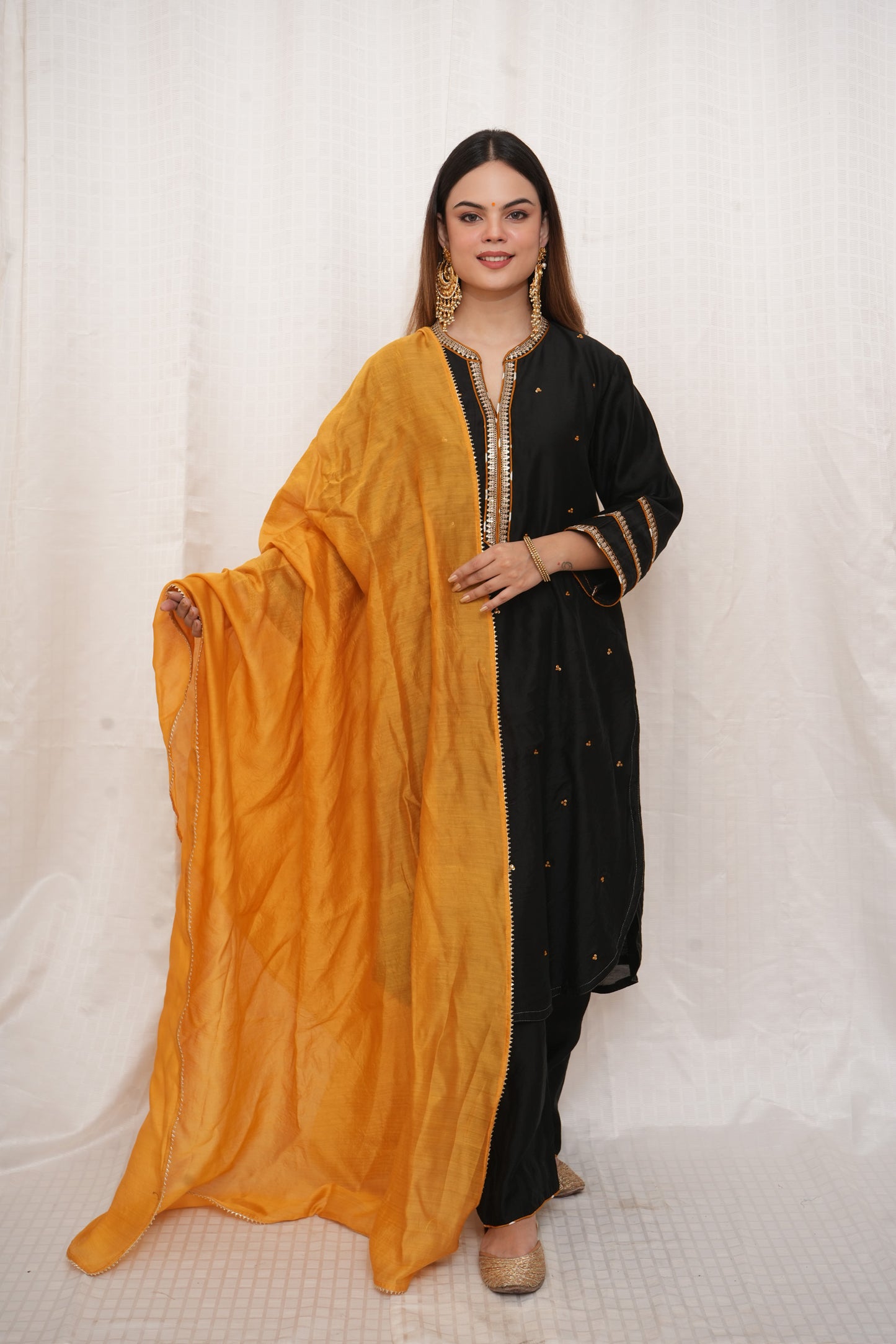 Black sequence embellished Chanderi suitset with yellow dupatta