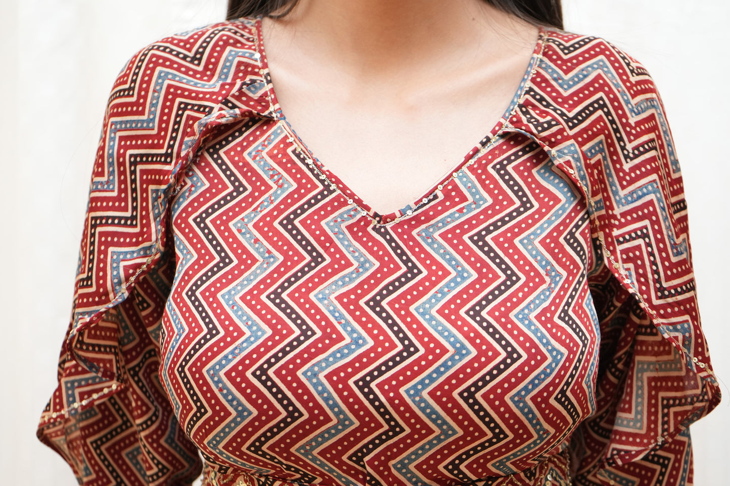 Red Zigzag ajrakh sequence embellished petal sleeve tier dress