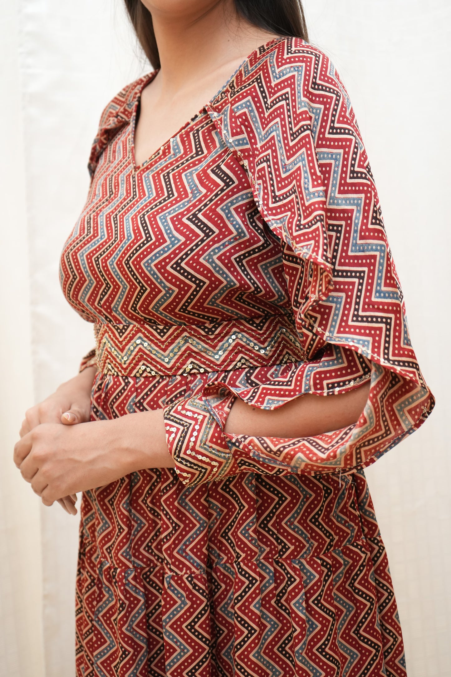 Red Zigzag ajrakh sequence embellished petal sleeve tier dress